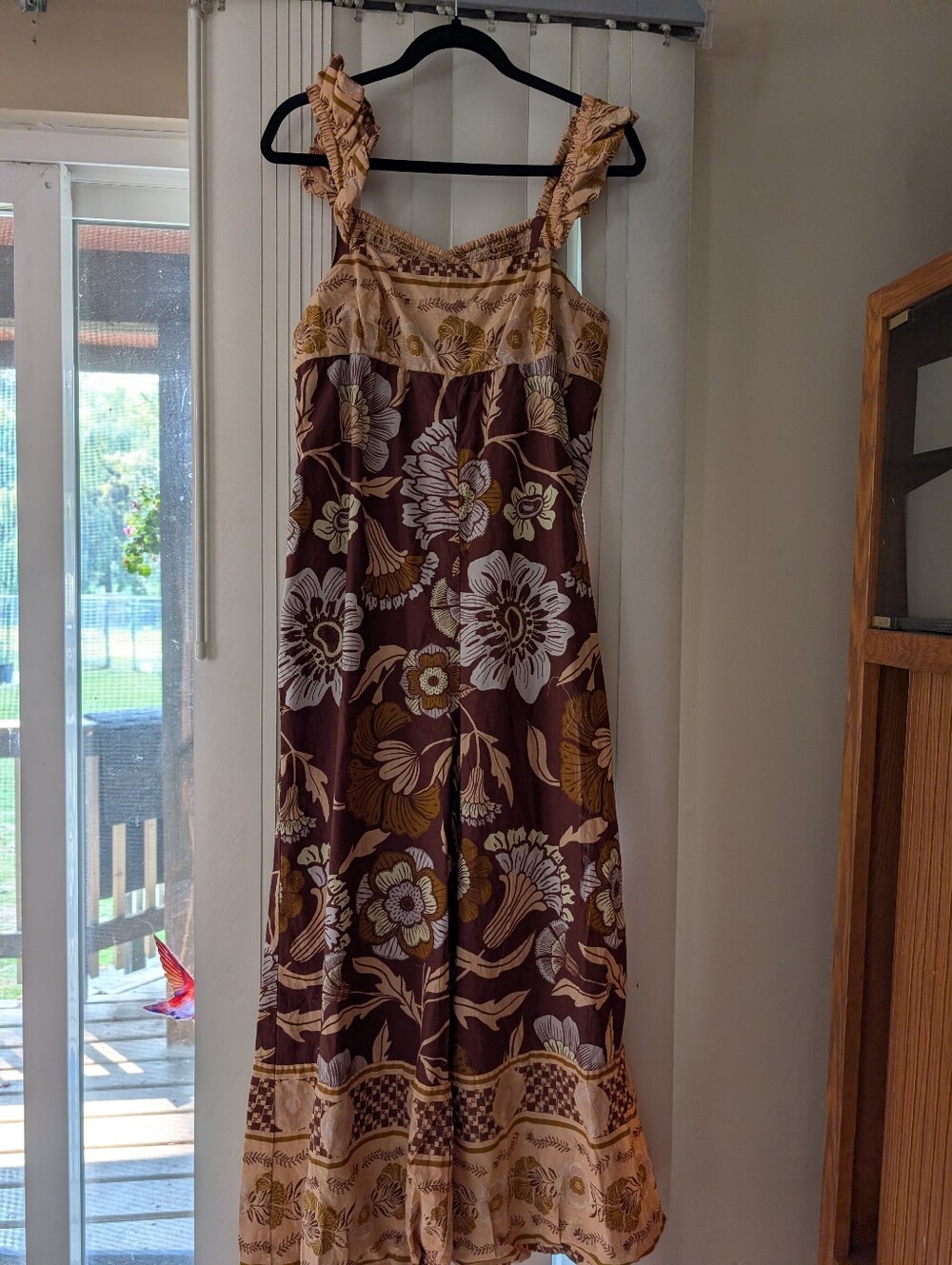 Brown Floral Romper with flutter straps.